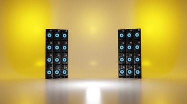 Tower of loudspeakers on stage. Music concert, recording studio concept. Digital 3D render.