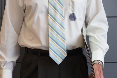 Businessman with an ink stained shirt