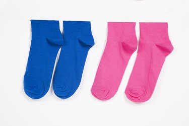 Close-up of socks hanging over white background
