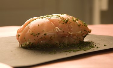 Uncooked roast on counter with seasonings