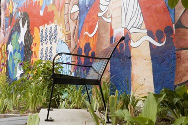 Close-up of chair in front of a painted wall, Washington DC, USA