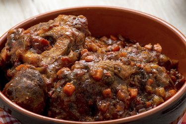stew with mushrooms in a terracotta bowl