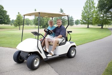 Man and woman in golfcart
