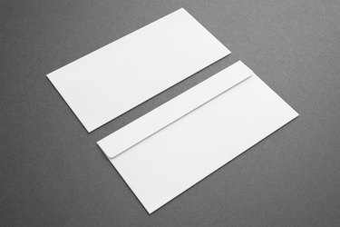 Blank envelopes on dark background. Front and back side.