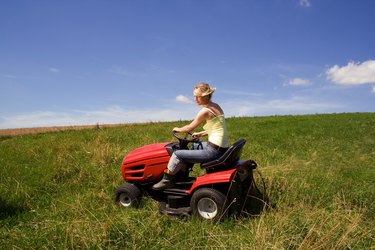 young girl with mowing machine