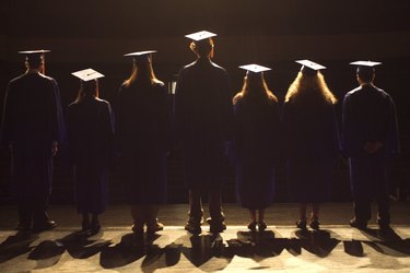 Students standing on stage at a graduation ceremony