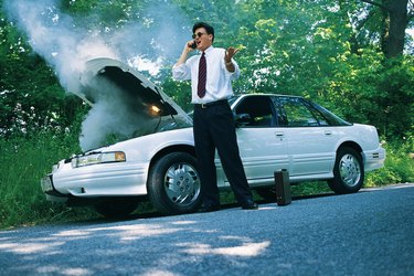 Man calling insurance agent for car trouble