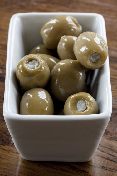 Green Olives in a White Bowl