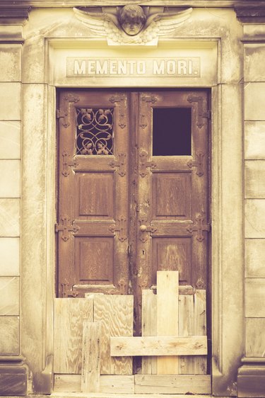 boarded up door to a crypt