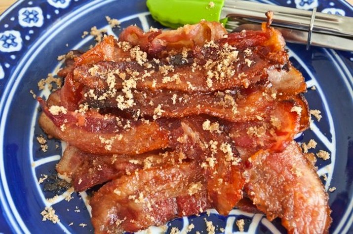 Platter of baked brown sugar bacon.