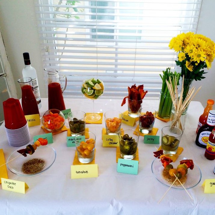 Table with components needed for bloody mary cocktails.