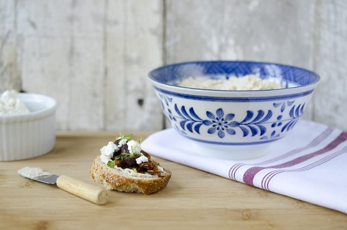 A single serving of Mediterranean crostini served with extra feta cheese.