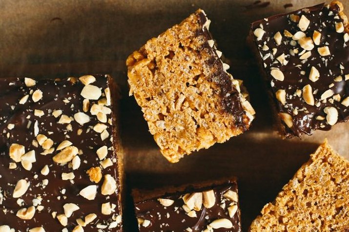 Squares of crispy chocolate peanut butter bars.