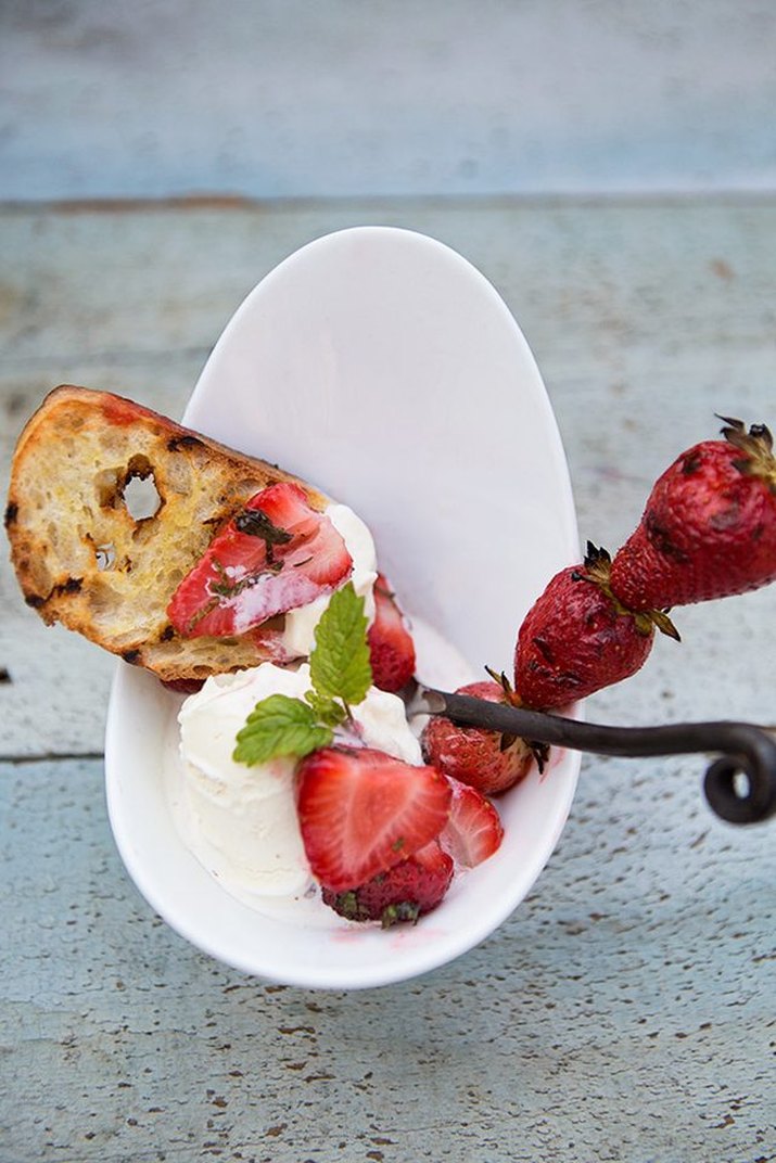 A bowl of grill-roasted strawberry crostini sundae.