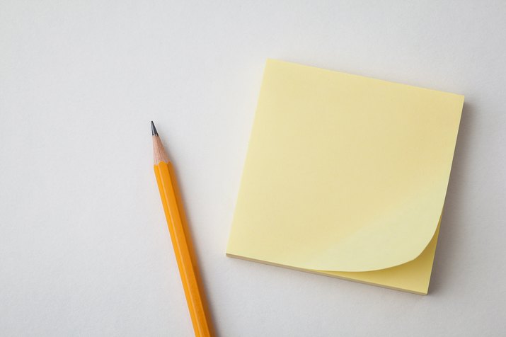 yellow sticky paper and pencil on white backgrounds, business concepts