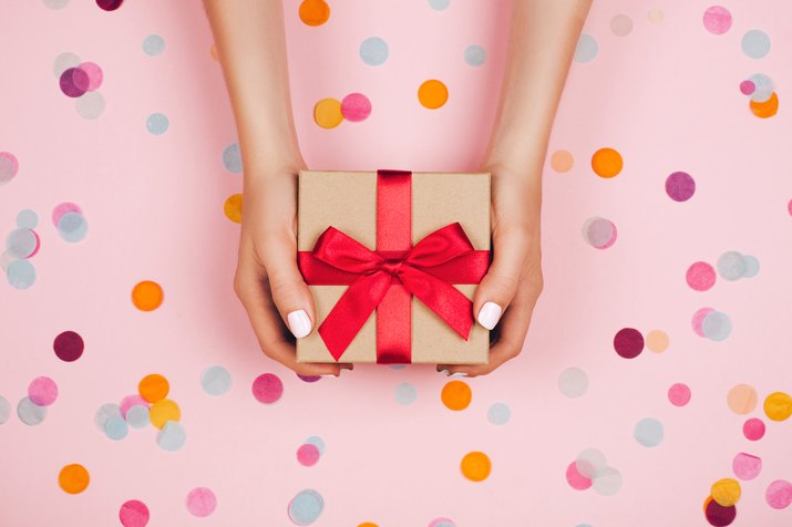 Hands holding present box